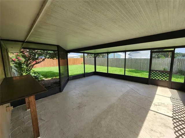 a view of a building with porch and outdoor space