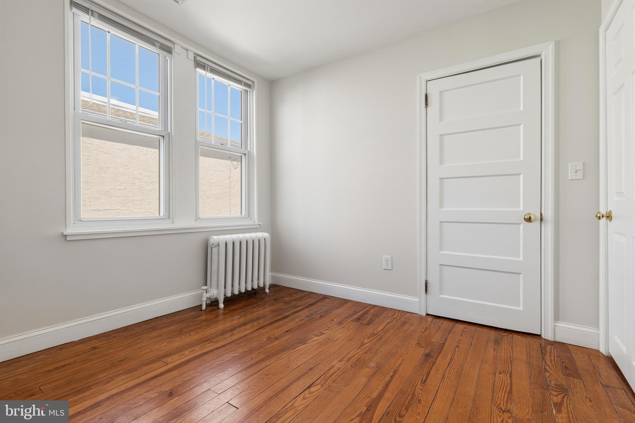 229 Wayne Avenue Narberth, PA 19072 - Photo 23 of 35 a view of empty room with wooden floor and fan