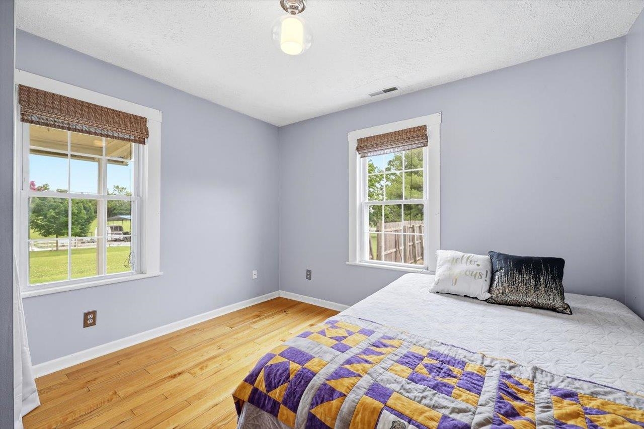 1296 New Hope Road Staunton, VA 24401 - Photo 13 of 37 a bedroom with a bed and a window