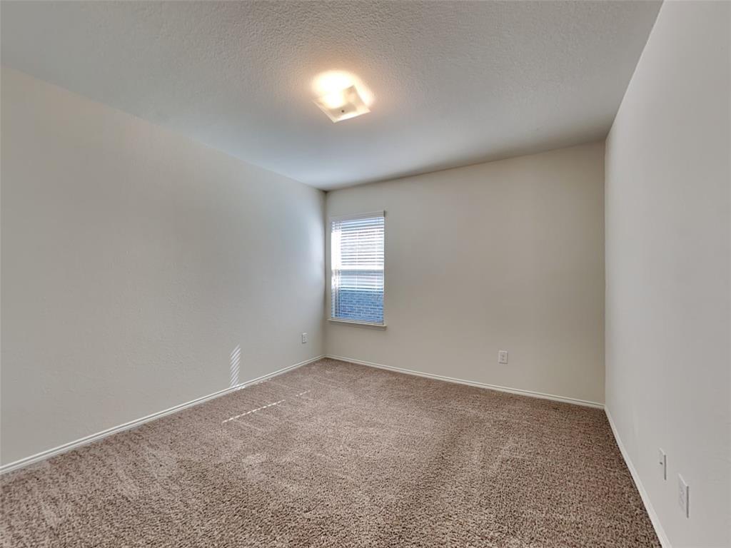 253 Pitt Circle Fate, TX 75189 - Photo 11 of 22 a view of an empty room and window