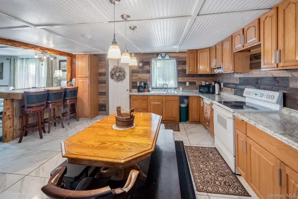 a kitchen with stainless steel appliances granite countertop a sink and cabinets