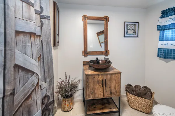 a bathroom with a glass shower door