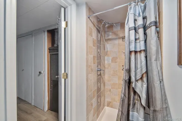 a bed sitting in a room next to a window