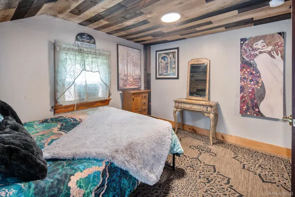 a bed room with a bed and a desk