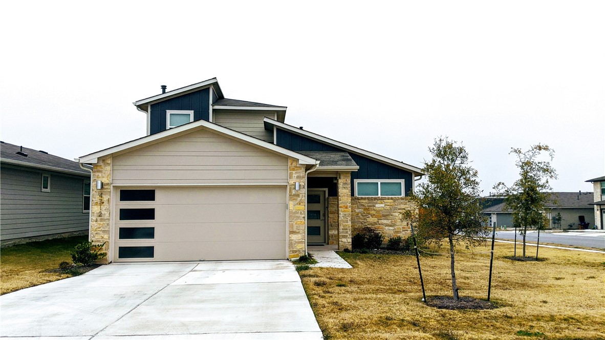 4712 Oxgang Drive Pflugerville, TX 78660 - Photo 2 of 33 a front view of a house with a garage