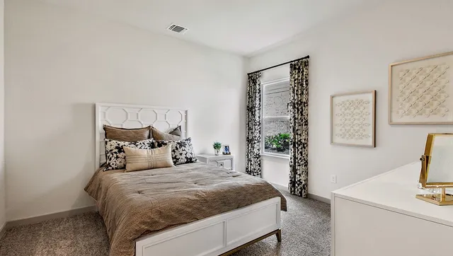 a bathroom with a sink a toilet a mirror and shower