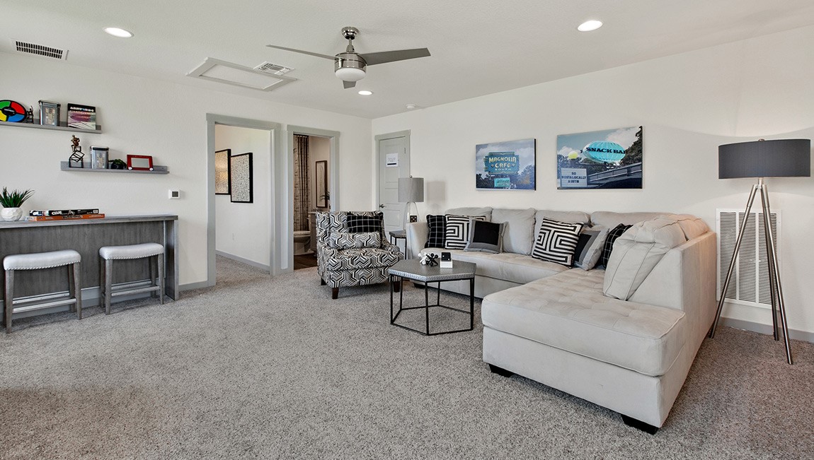 4712 Oxgang Drive Pflugerville, TX 78660 - Photo 28 of 33 a living room with furniture and a chandelier