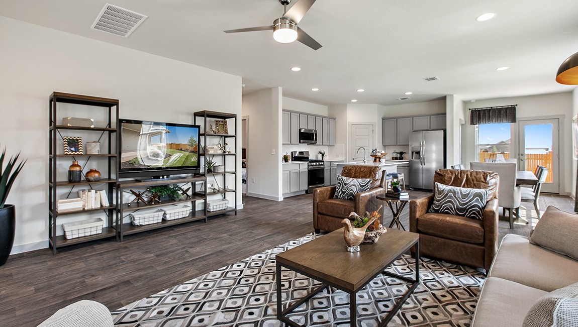 4712 Oxgang Drive Pflugerville, TX 78660 - Photo 8 of 33 a living room with furniture and a flat screen tv