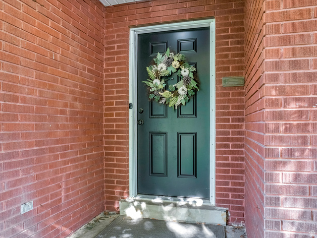 523 South Main Street Payson, UT 84651 - Photo 8 of 41 Brick exterior facade featuring a paneled front door with white trim