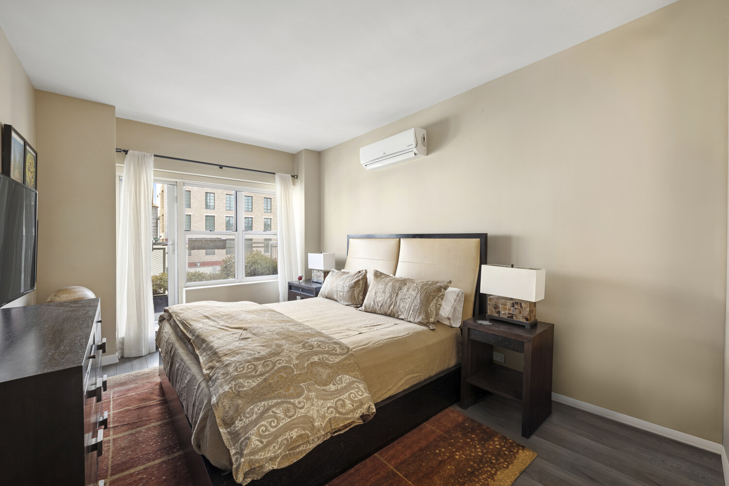 2 5th Avenue, Unit 14R Manhattan, NY 10011 - Photo 10 of 21 a bedroom with a bed and wooden floor