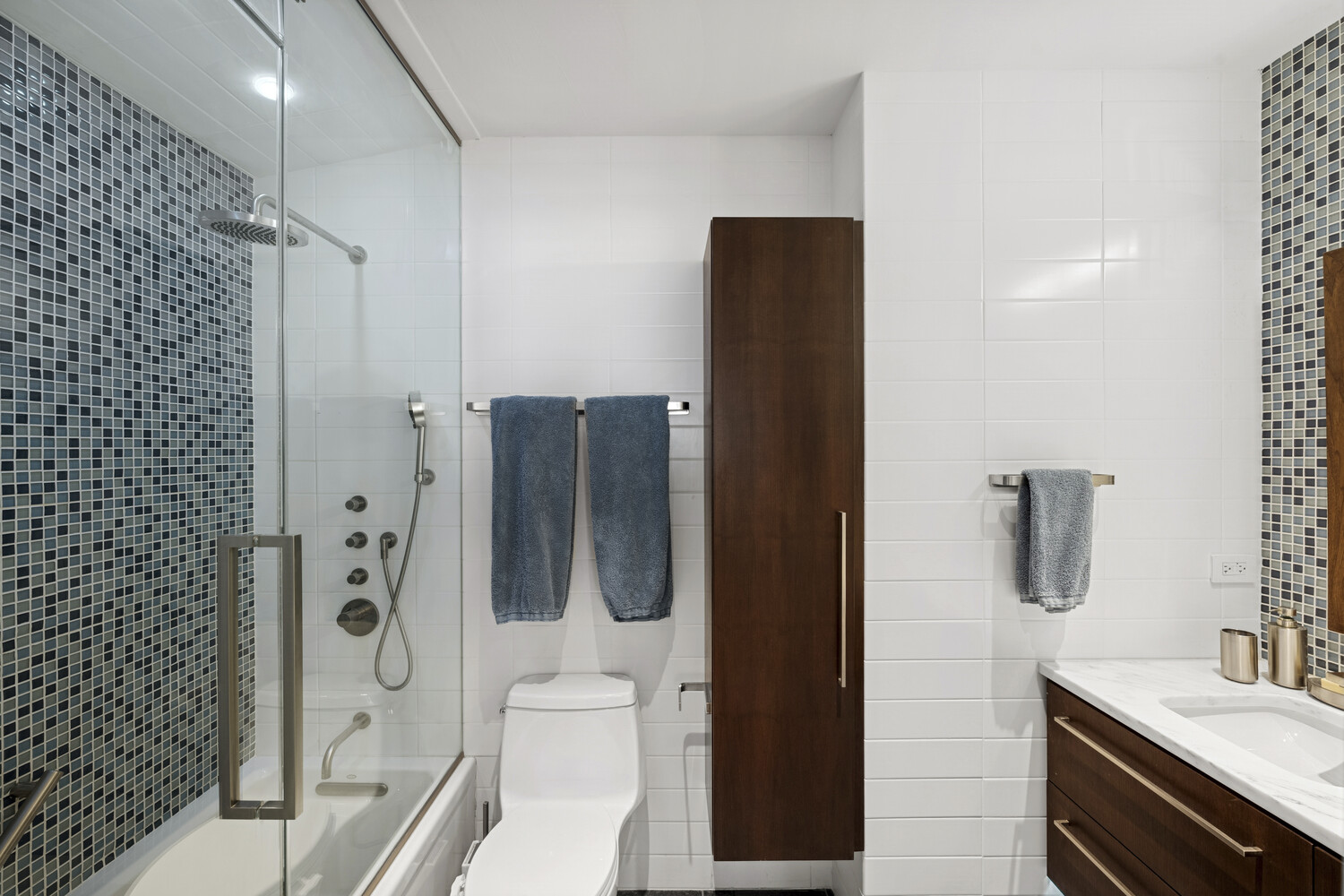 2 5th Avenue, Unit 14R Manhattan, NY 10011 - Photo 13 of 21 a bathroom with a shower and a sink