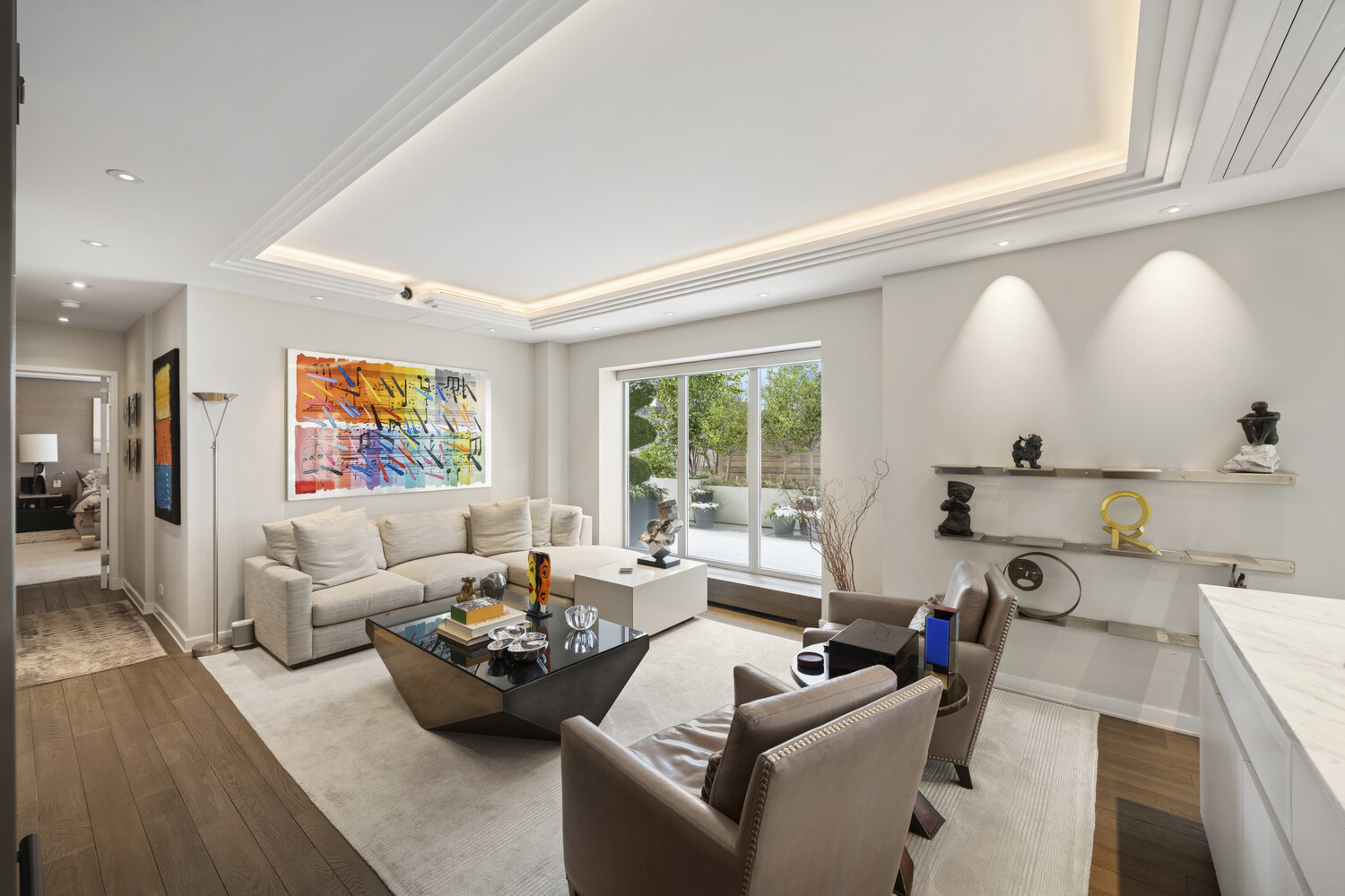 2 5th Avenue, Unit 14R Manhattan, NY 10011 - Photo 15 of 21 a living room with furniture and a large window