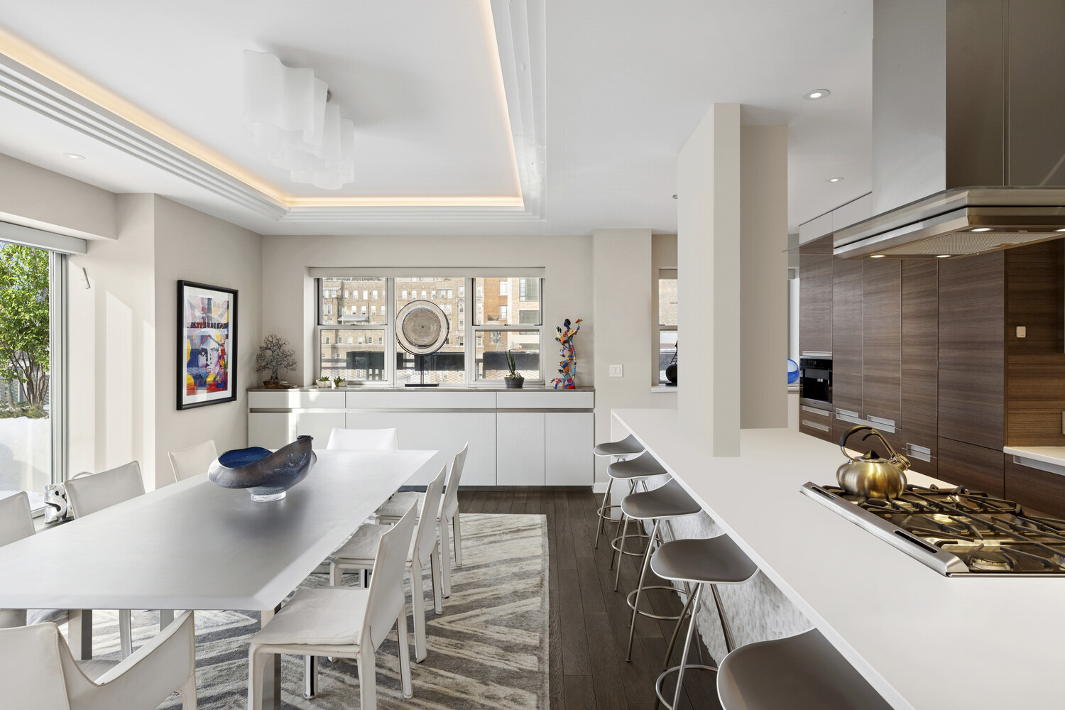 2 5th Avenue, Unit 14R Manhattan, NY 10011 - Photo 16 of 21 a dining room with furniture and a large window