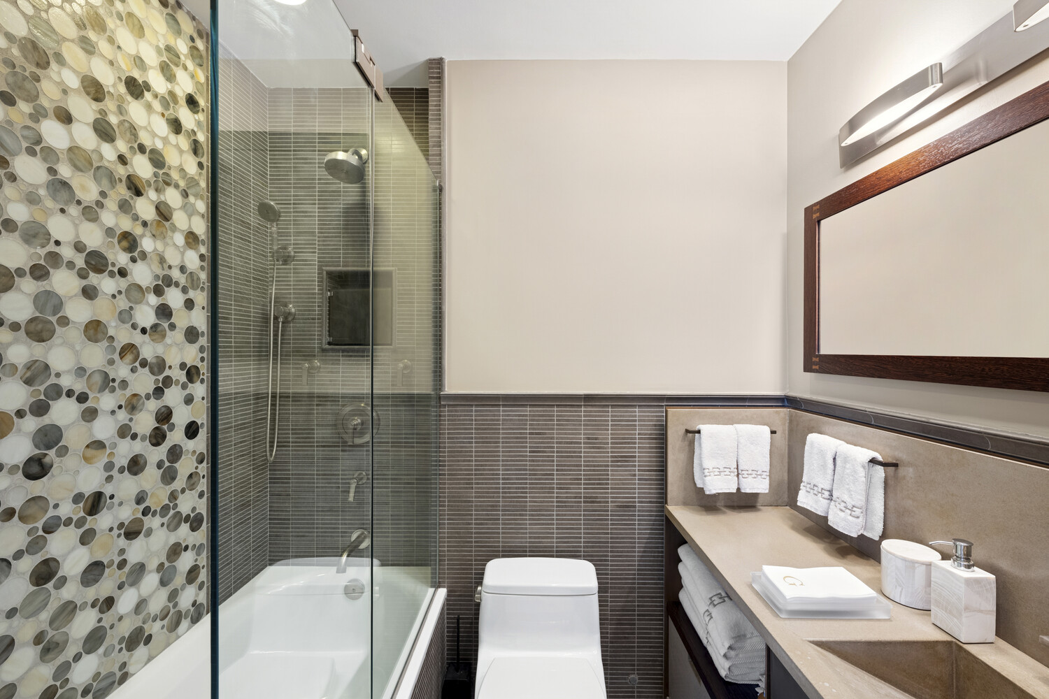 2 5th Avenue, Unit 14R Manhattan, NY 10011 - Photo 18 of 21 a bathroom with a sink toilet and shower