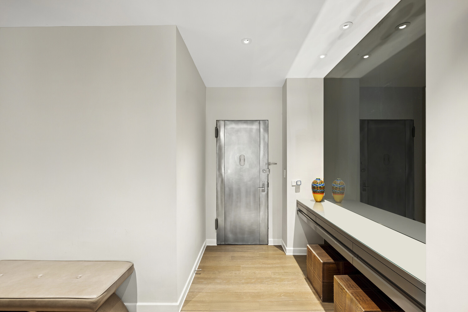 2 5th Avenue, Unit 14R Manhattan, NY 10011 - Photo 19 of 21 a hallway with sliding door and wooden floor