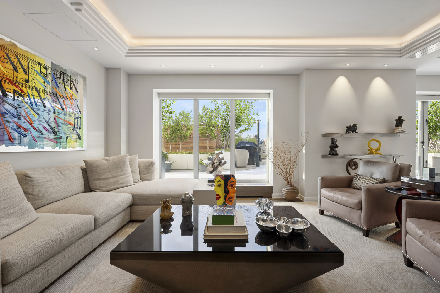 2 5th Avenue, Unit 14R Manhattan, NY 10011 - Photo 4 of 21 a living room with furniture and a large window