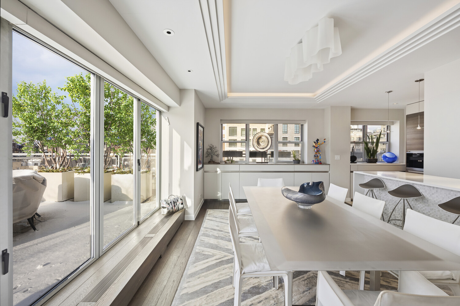 2 5th Avenue, Unit 14R Manhattan, NY 10011 - Photo 5 of 21 a living room with furniture and a large window