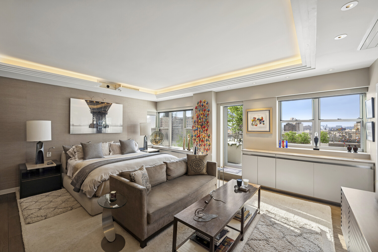 2 5th Avenue, Unit 14R Manhattan, NY 10011 - Photo 7 of 21 a bedroom with furniture and a large window