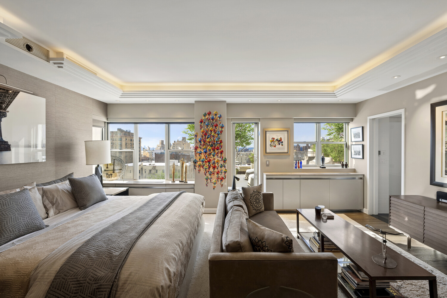 2 5th Avenue, Unit 14R Manhattan, NY 10011 - Photo 8 of 21 a bedroom with furniture and a potted plant