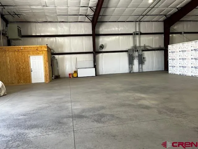 a view of a dry yard with trees