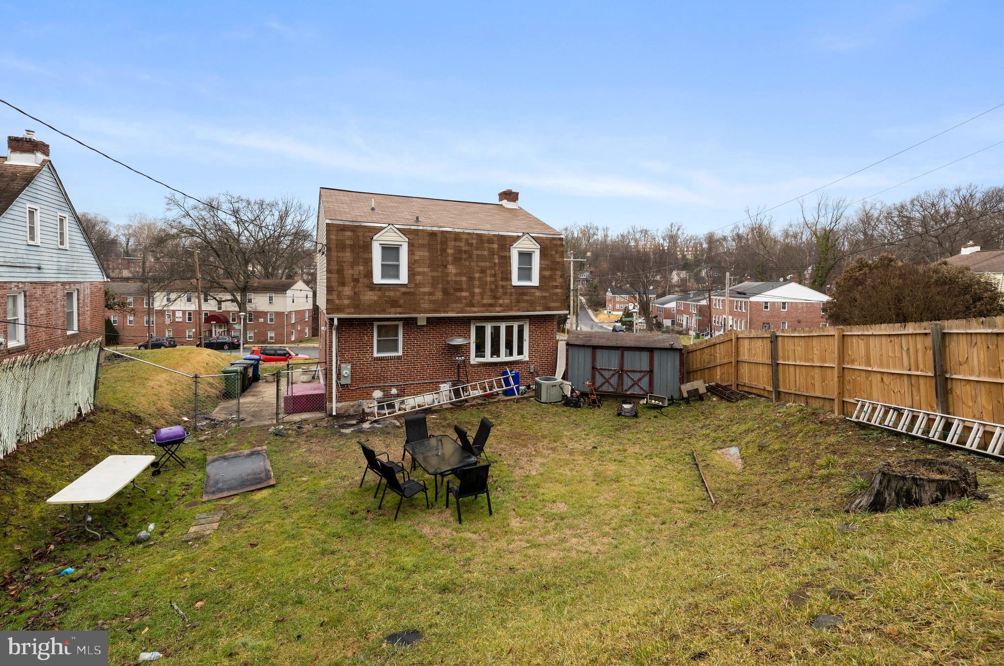 2717 Talbot Road Baltimore, MD 21216 - Photo 12 of 12 a backyard of a house with yard fire pit and outdoor seating