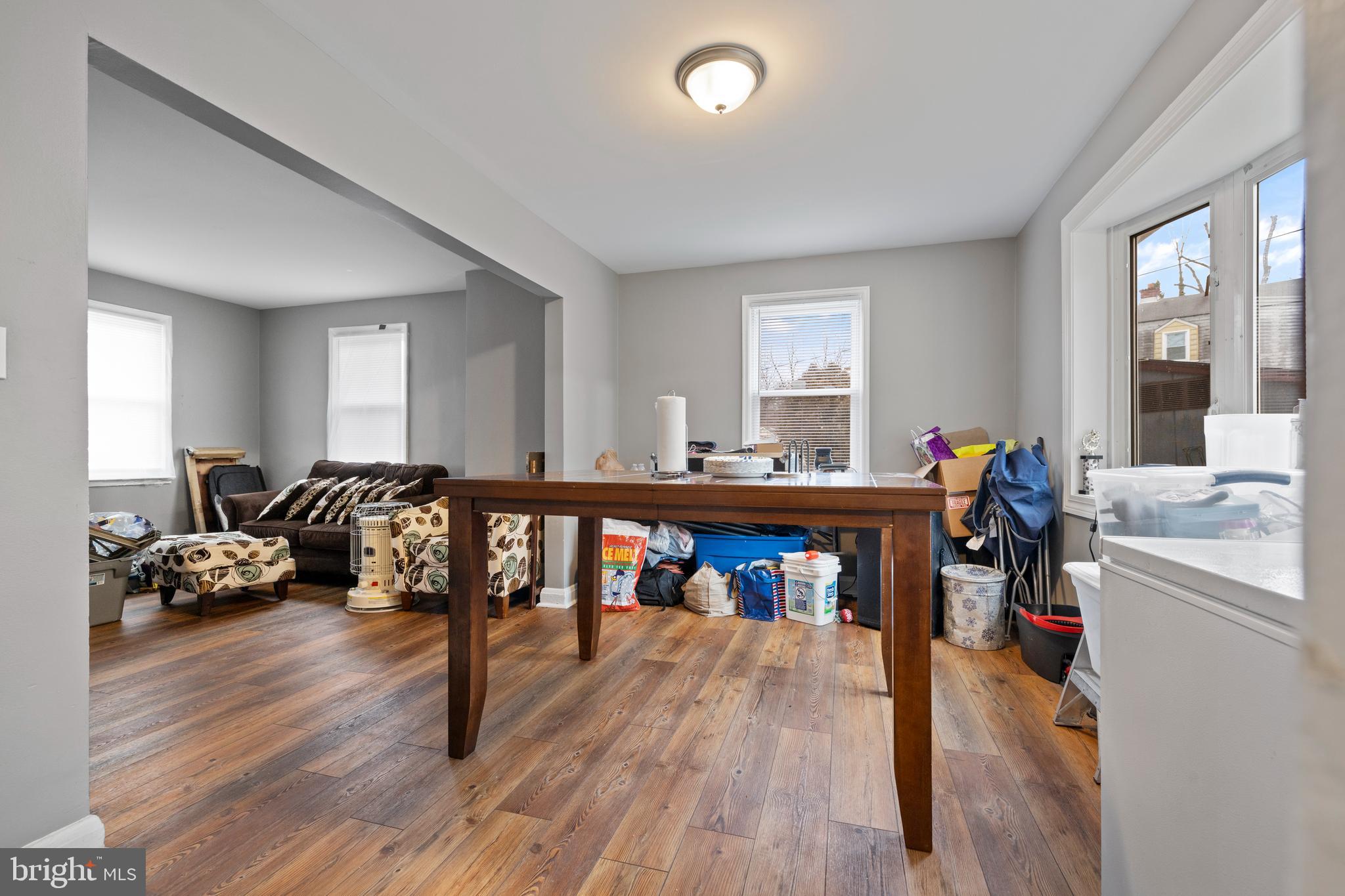 2717 Talbot Road Baltimore, MD 21216 - Photo 4 of 12 a living room with furniture and a wooden floor