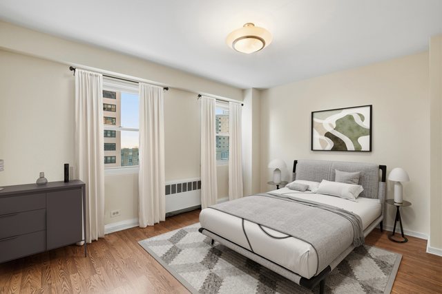 2909 North Sheridan Road, Unit 802 Chicago, IL 60657 - Photo 14 of 22 a bedroom with a bed and a window