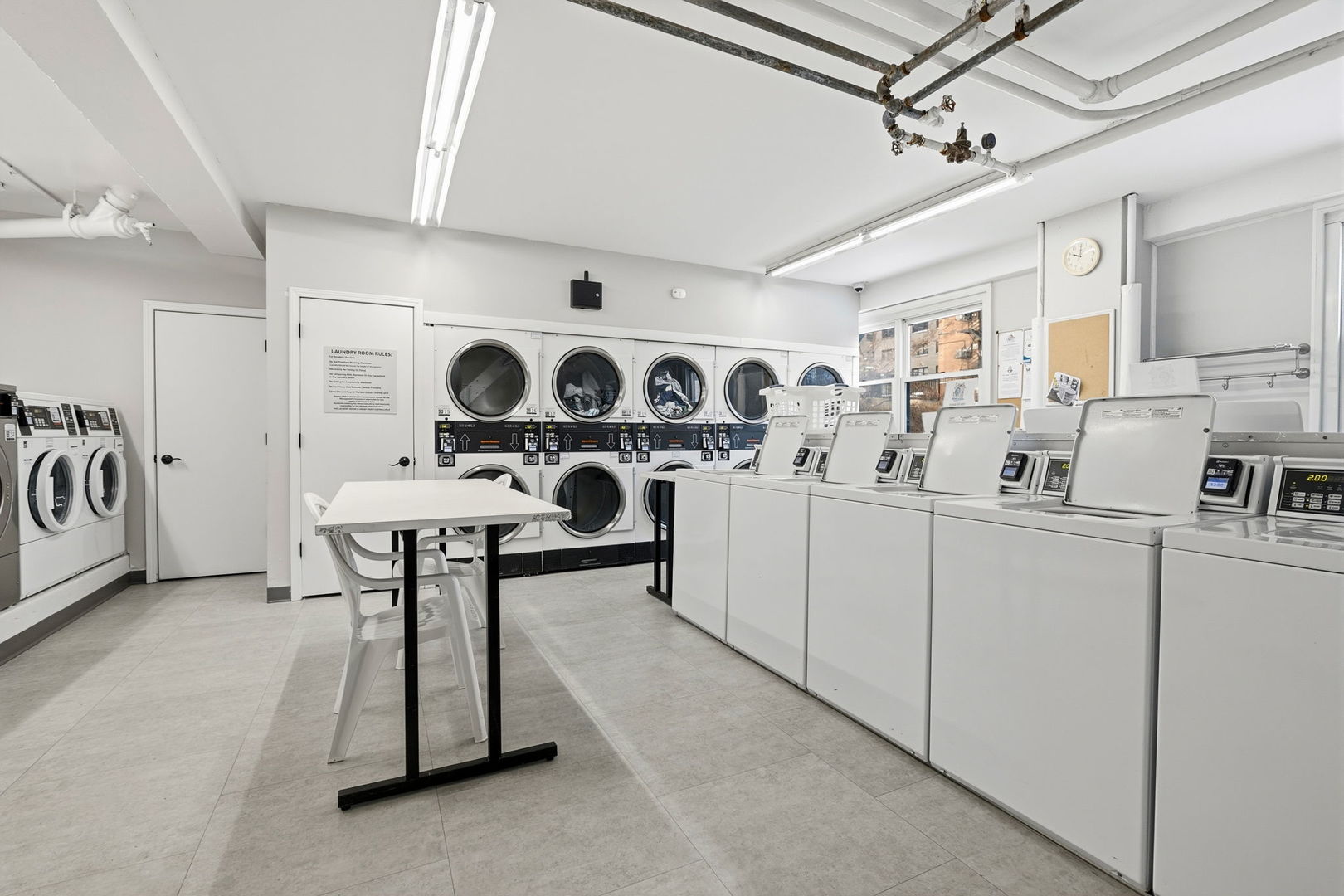 2909 North Sheridan Road, Unit 802 Chicago, IL 60657 - Photo 19 of 22 a living room with lots of furniture and white walls