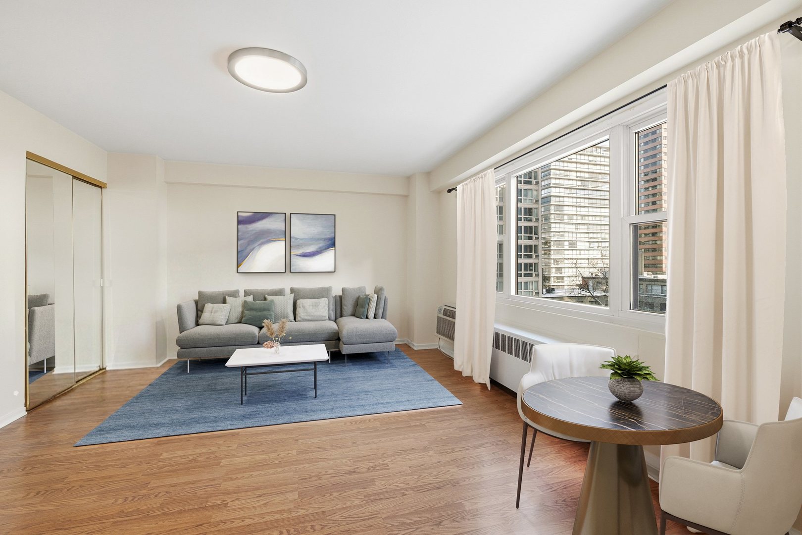 2909 North Sheridan Road, Unit 802 Chicago, IL 60657 - Photo 2 of 22 a living room with furniture and a large window