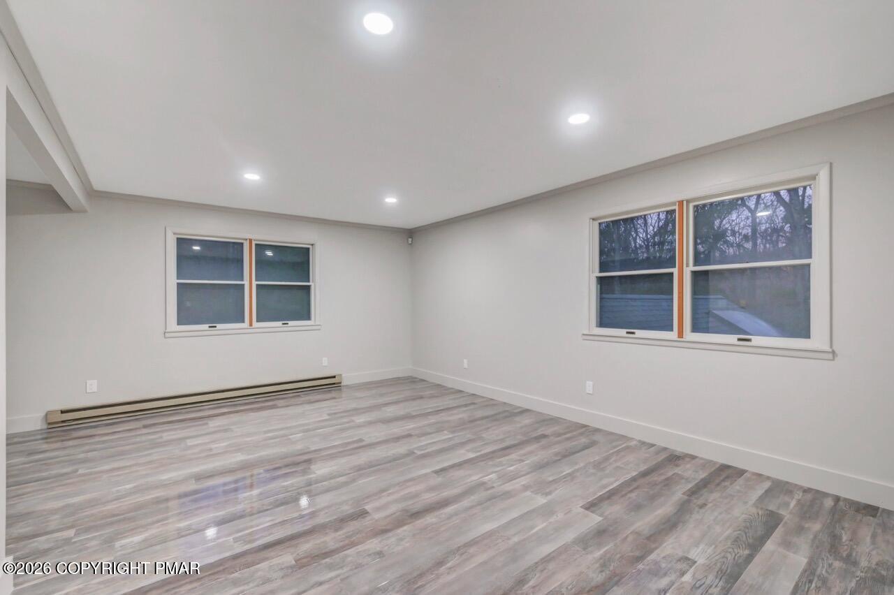 384 Devils Hole Road Cresco, PA 18326 - Photo 53 of 97 a view of an empty room with a window and wooden floor