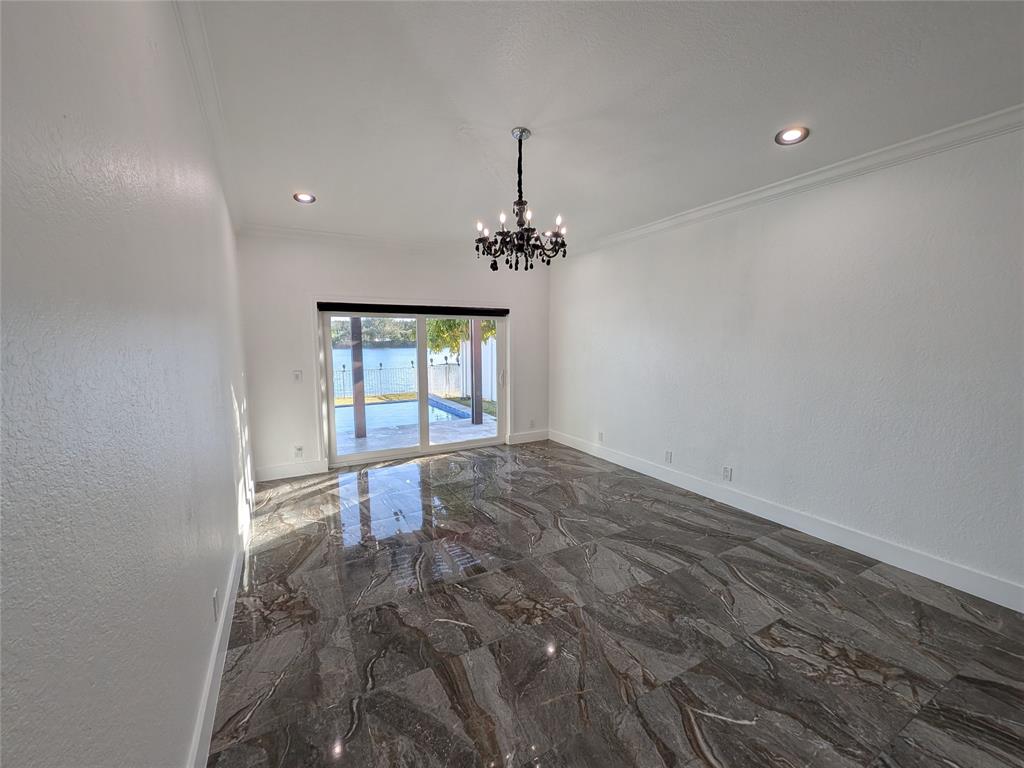 4572 Southwest 14th Street Deerfield Beach, FL 33442 - Photo 15 of 58 wooden floor in an empty room with a window