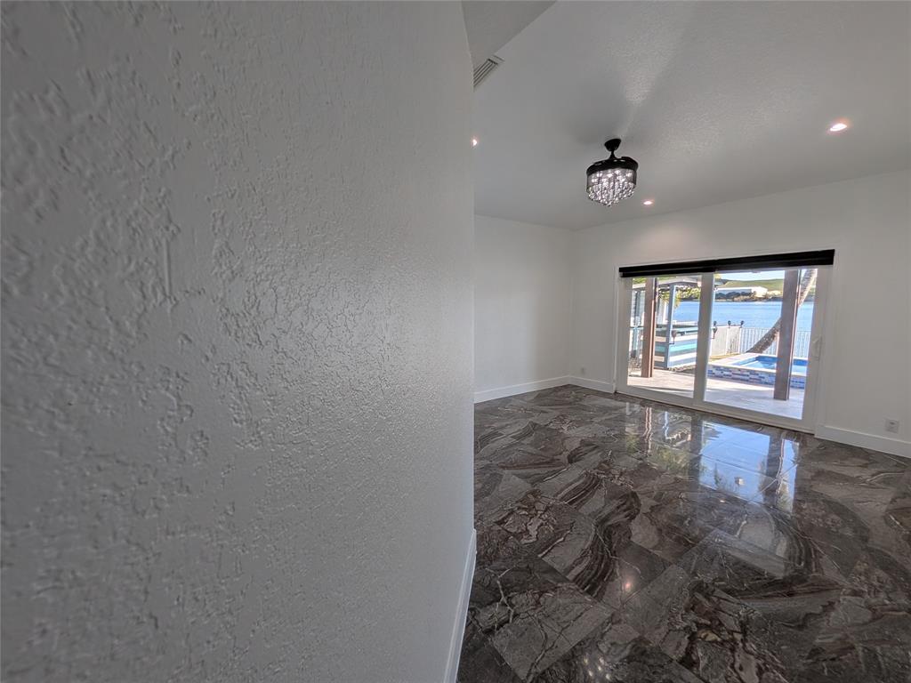 4572 Southwest 14th Street Deerfield Beach, FL 33442 - Photo 17 of 58 an empty room with windows