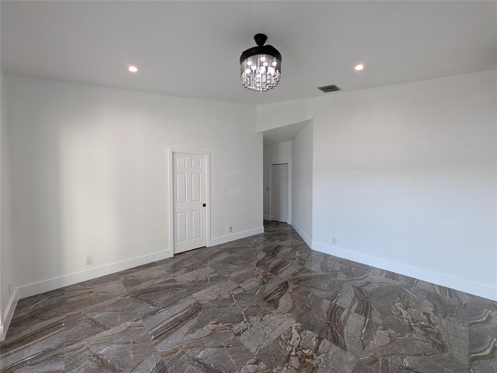 4572 Southwest 14th Street Deerfield Beach, FL 33442 - Photo 18 of 58 a view of an empty room and a window