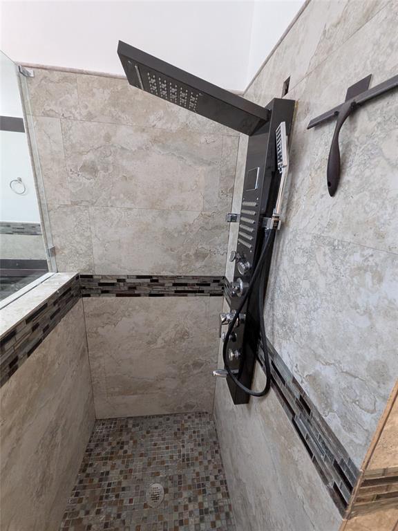 4572 Southwest 14th Street Deerfield Beach, FL 33442 - Photo 22 of 58 a bathroom with a shower