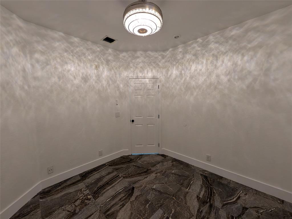 4572 Southwest 14th Street Deerfield Beach, FL 33442 - Photo 29 of 58 a view of a room with rack on the wall