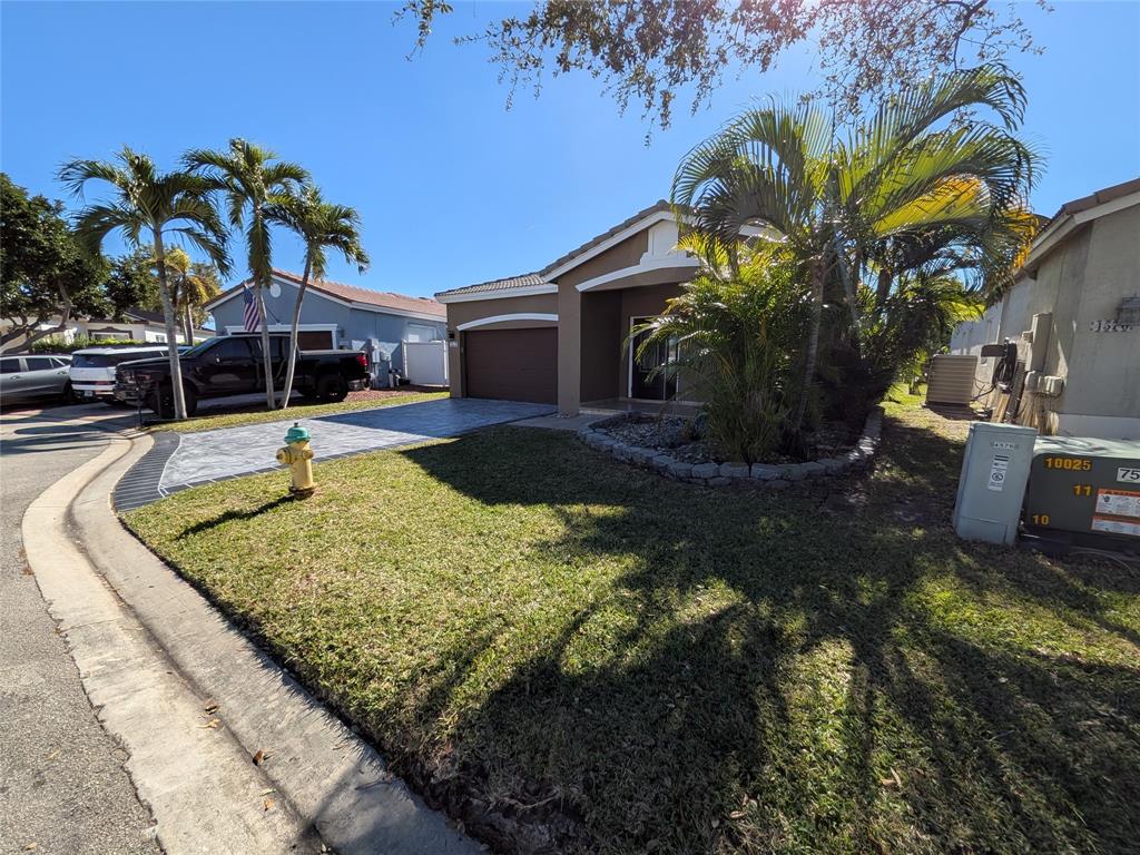 4572 Southwest 14th Street Deerfield Beach, FL 33442 - Photo 3 of 58 a swimming pool with outdoor seating yard and barbeque oven