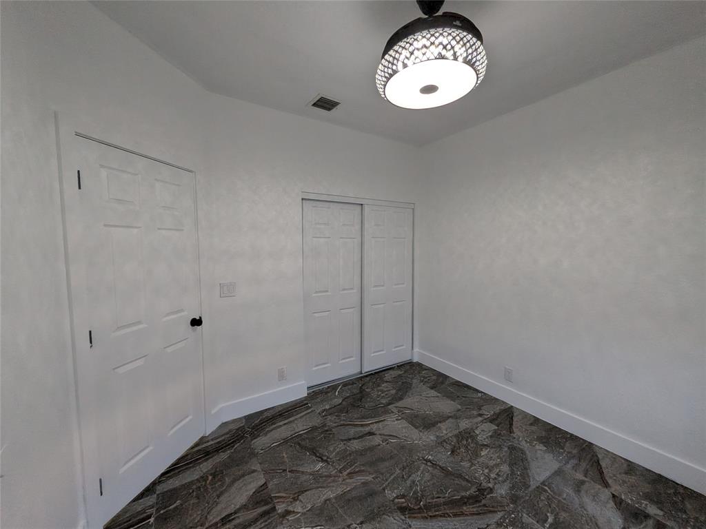 4572 Southwest 14th Street Deerfield Beach, FL 33442 - Photo 31 of 58 a view of a room with rack on the wall