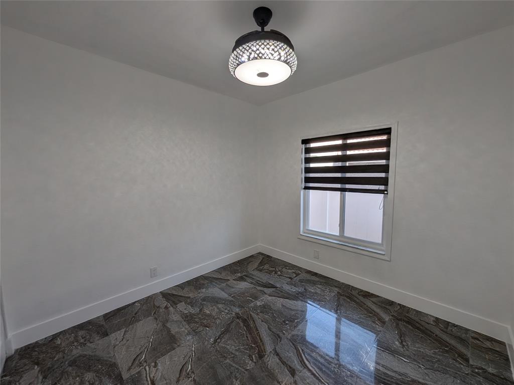 4572 Southwest 14th Street Deerfield Beach, FL 33442 - Photo 33 of 58 a view of an empty room with a window