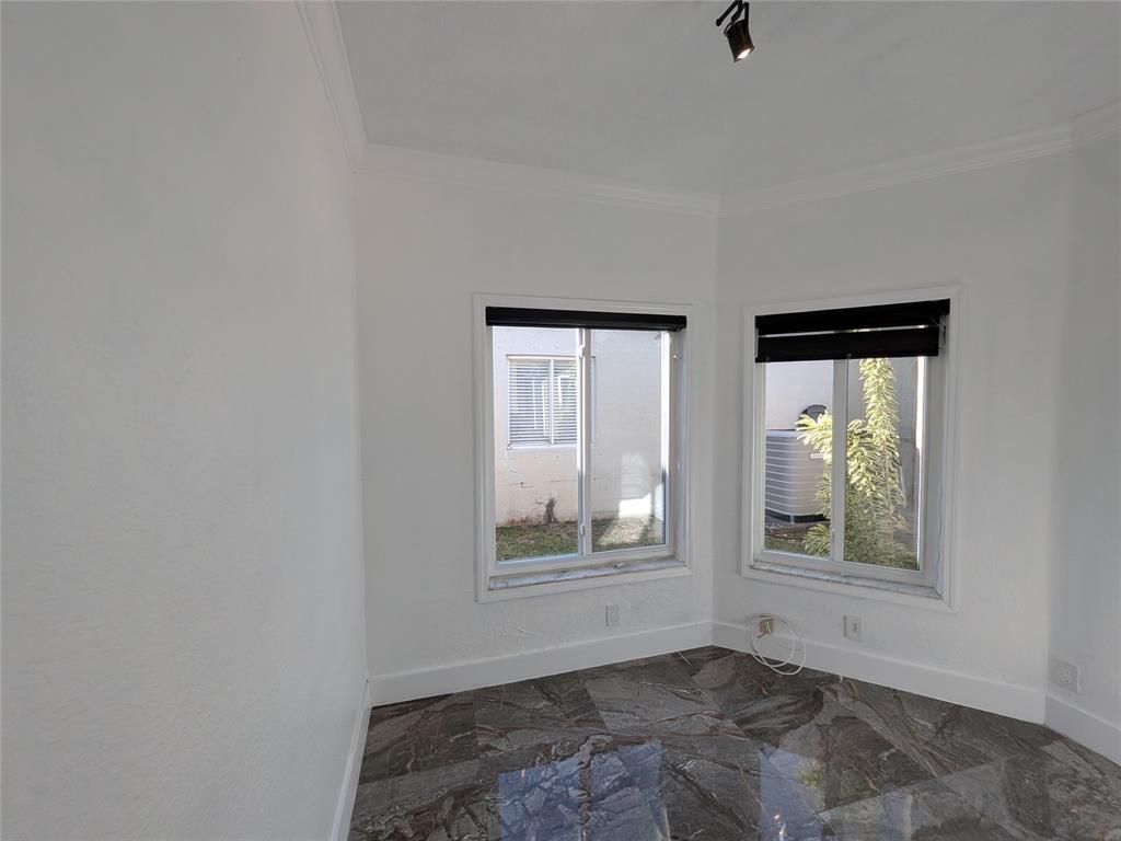 4572 Southwest 14th Street Deerfield Beach, FL 33442 - Photo 39 of 58 an empty room with windows