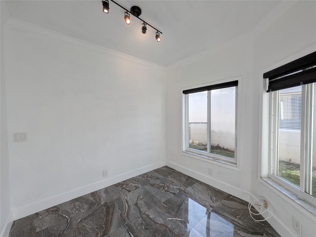 4572 Southwest 14th Street Deerfield Beach, FL 33442 - Photo 41 of 58 a view of empty room with wooden floor and fan