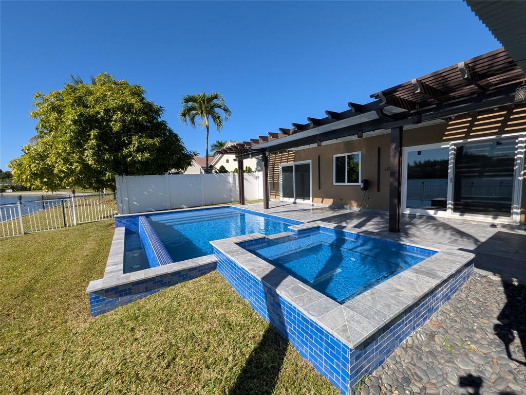 4572 Southwest 14th Street Deerfield Beach, FL 33442 - Photo 44 of 58 a view of a backyard with swimming pool