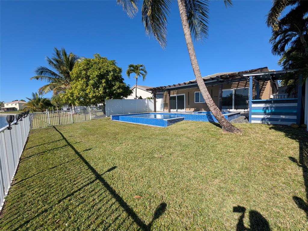 4572 Southwest 14th Street Deerfield Beach, FL 33442 - Photo 45 of 58 a view of a house with a yard