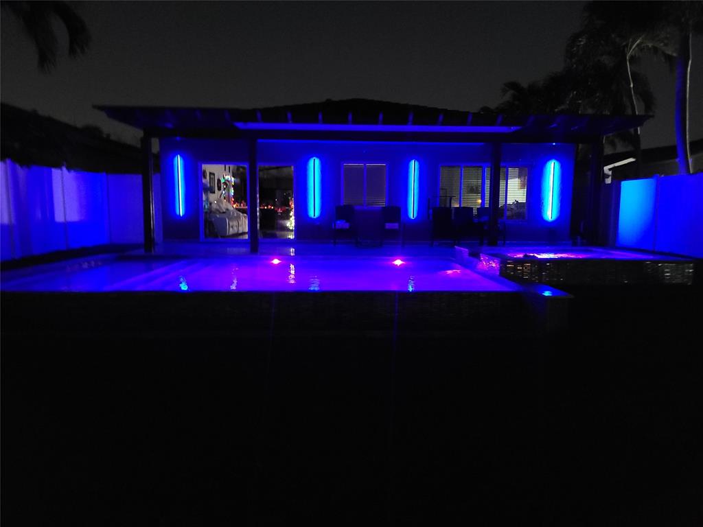 4572 Southwest 14th Street Deerfield Beach, FL 33442 - Photo 51 of 58 a view of swimming pool outdoor seating