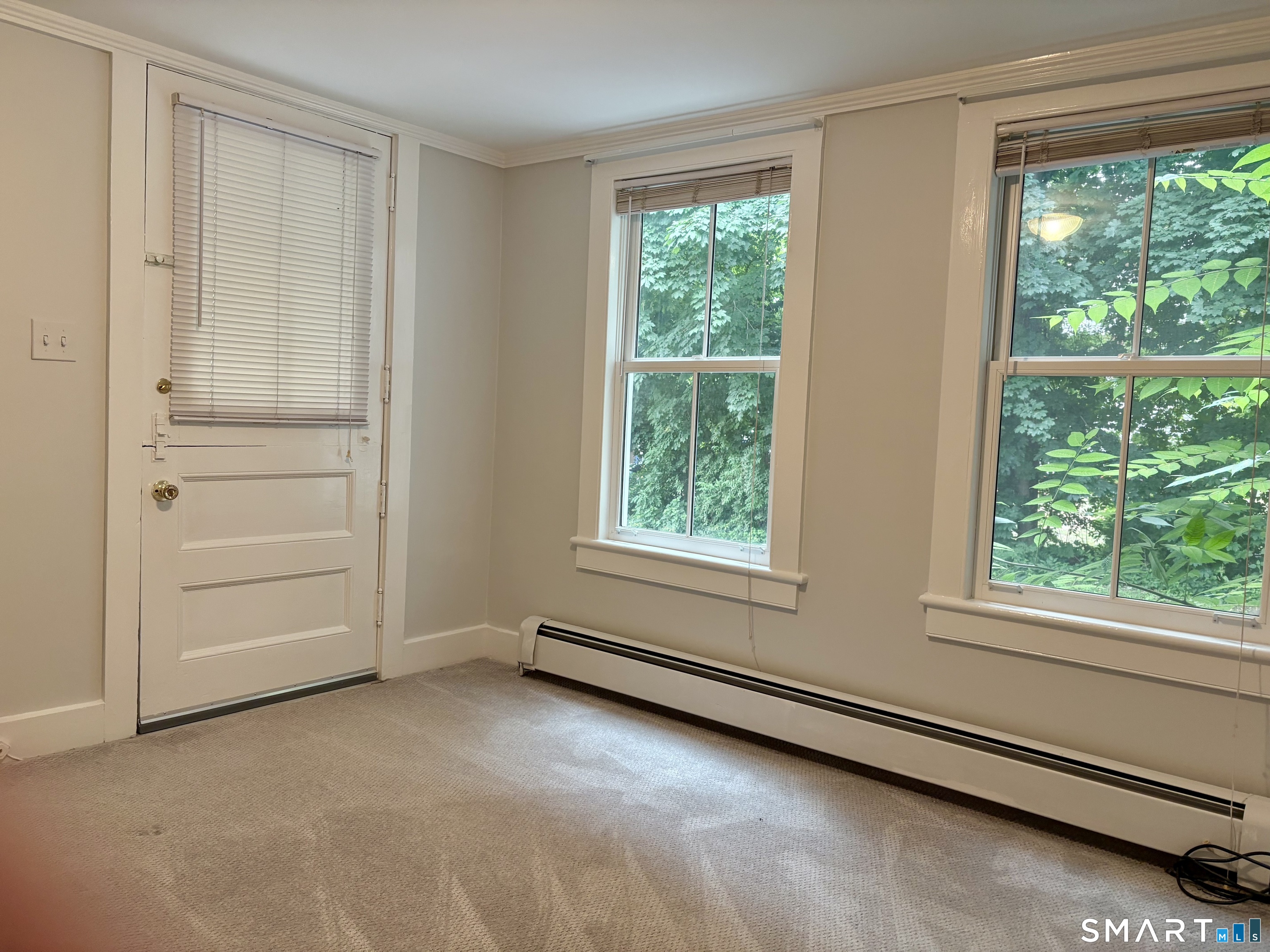 21 West Lane, Unit 2 Ridgefield, CT 06877 - Photo 9 of 9 an empty room with windows and closet