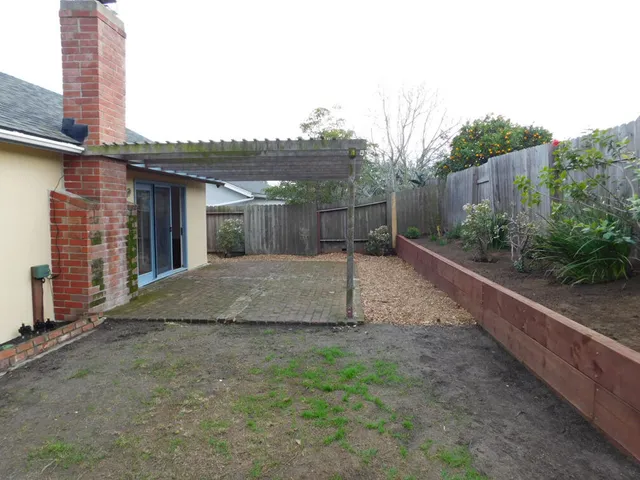 a backyard of a house with lots of green space