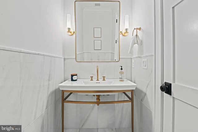 a kitchen with stainless steel appliances kitchen island granite countertop a sink and cabinets