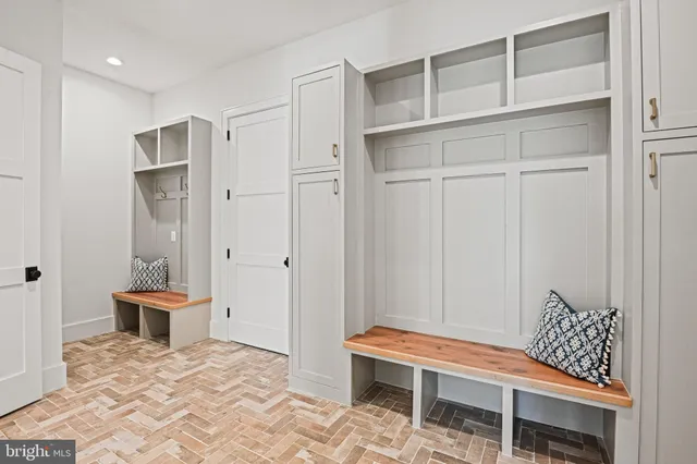 a view of a hallway view with wooden floor and staircase