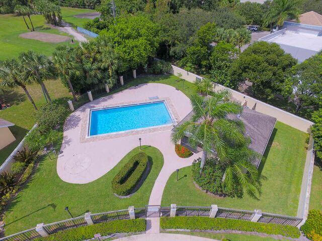 252 Moccasin Trail West Jupiter, FL 33458 - Photo 24 of 24 an aerial view of a swimming pool patio and outdoor seating
