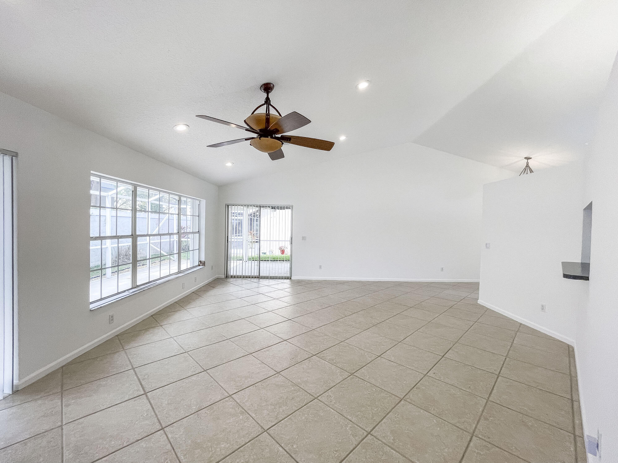 252 Moccasin Trail West Jupiter, FL 33458 - Photo 6 of 24 a view of an empty room with a window