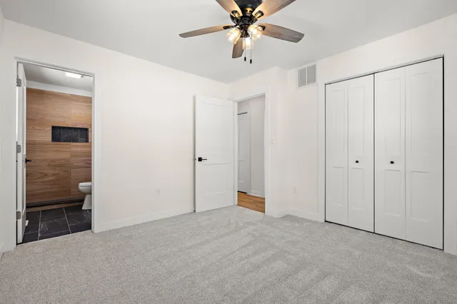 a view of an empty room with a bathroom